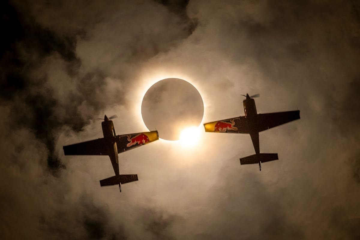 Red Bull Aerobatic Pilots Fly Through Rare Solar Eclipse